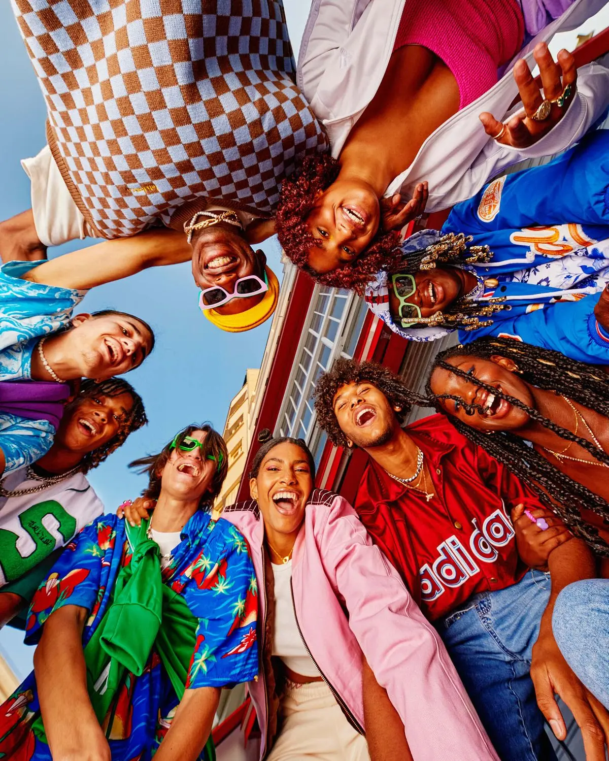 Friends standing in a circle laughing together